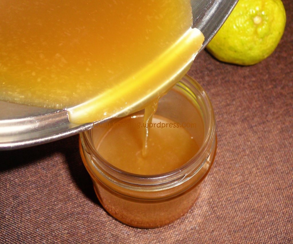 tangy coconut caramel sauce being poured into a glass jar 