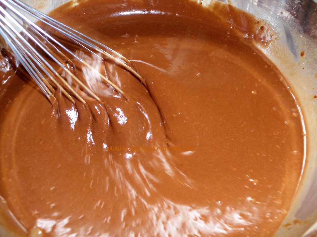 How to make chocolate cake; mixing the cake batter using a stainless steel whisk.